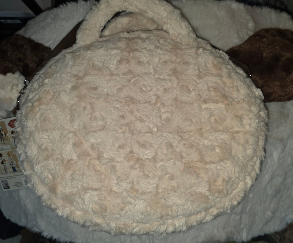 Doggy Bag with strap and handels and a plushie