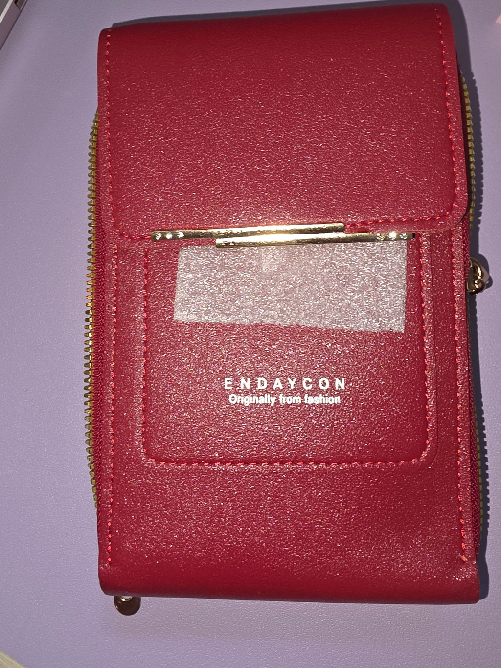 Small shiny red crossbody purse with strap
