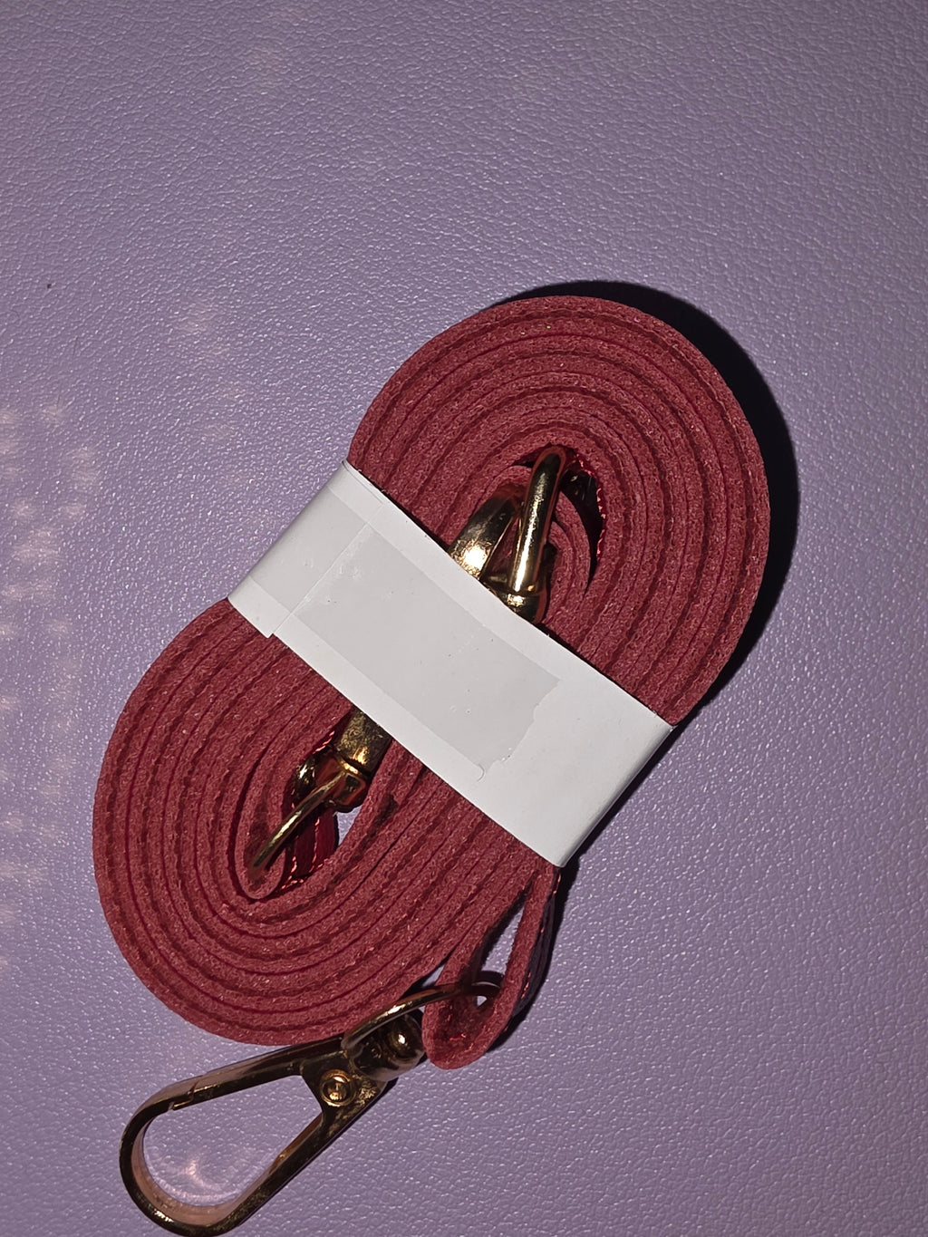 Small shiny red crossbody purse with strap