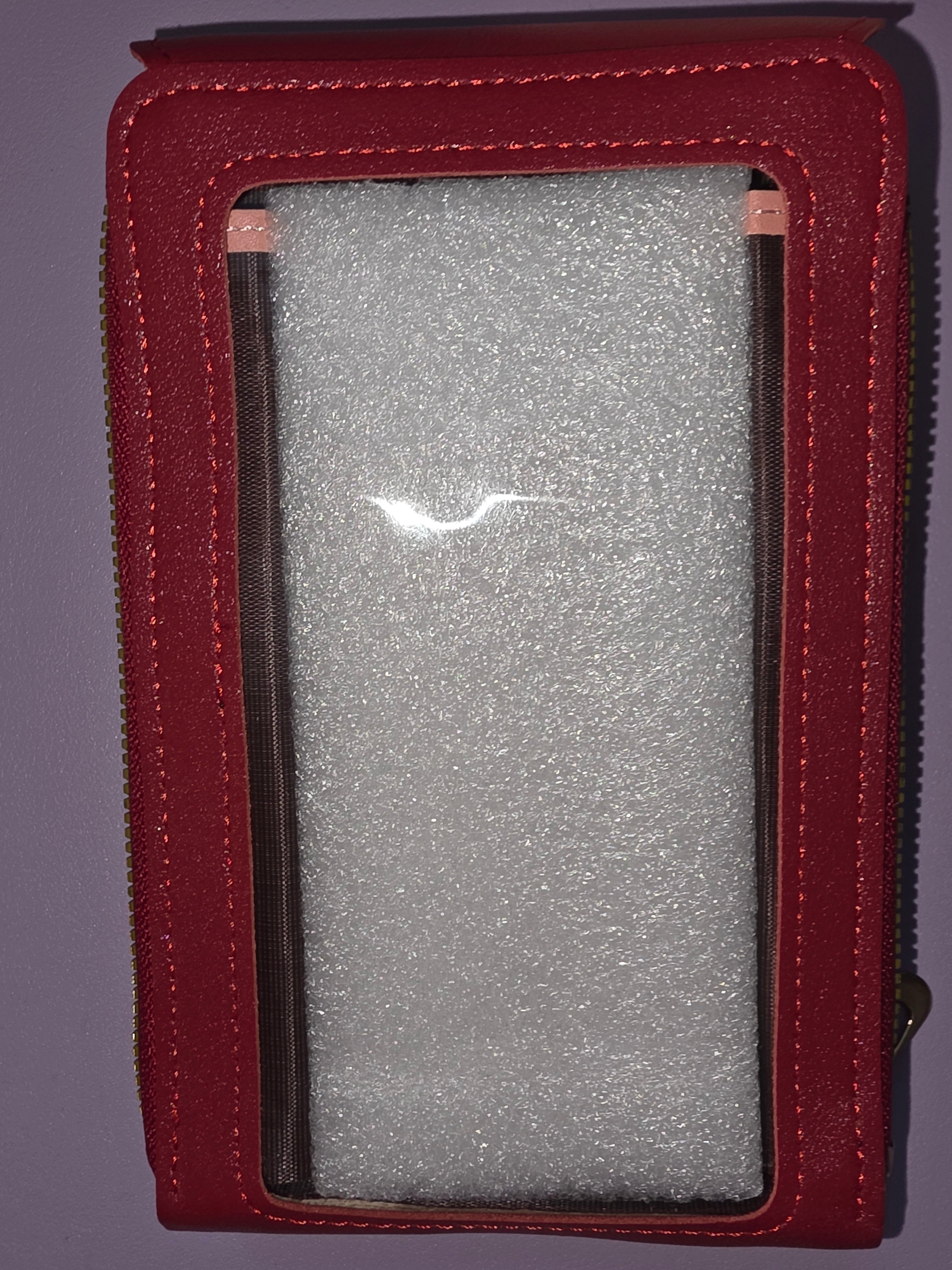 Small shiny red crossbody purse with strap