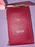 Small shiny red crossbody purse with strap