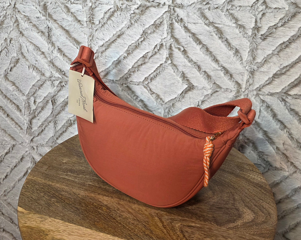 Universal thread co dark orange crescent shape purse
