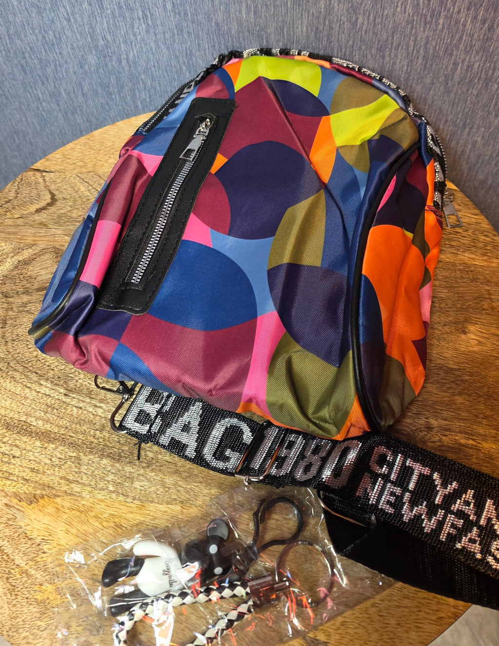 City and life sling small backpack with 2 charms