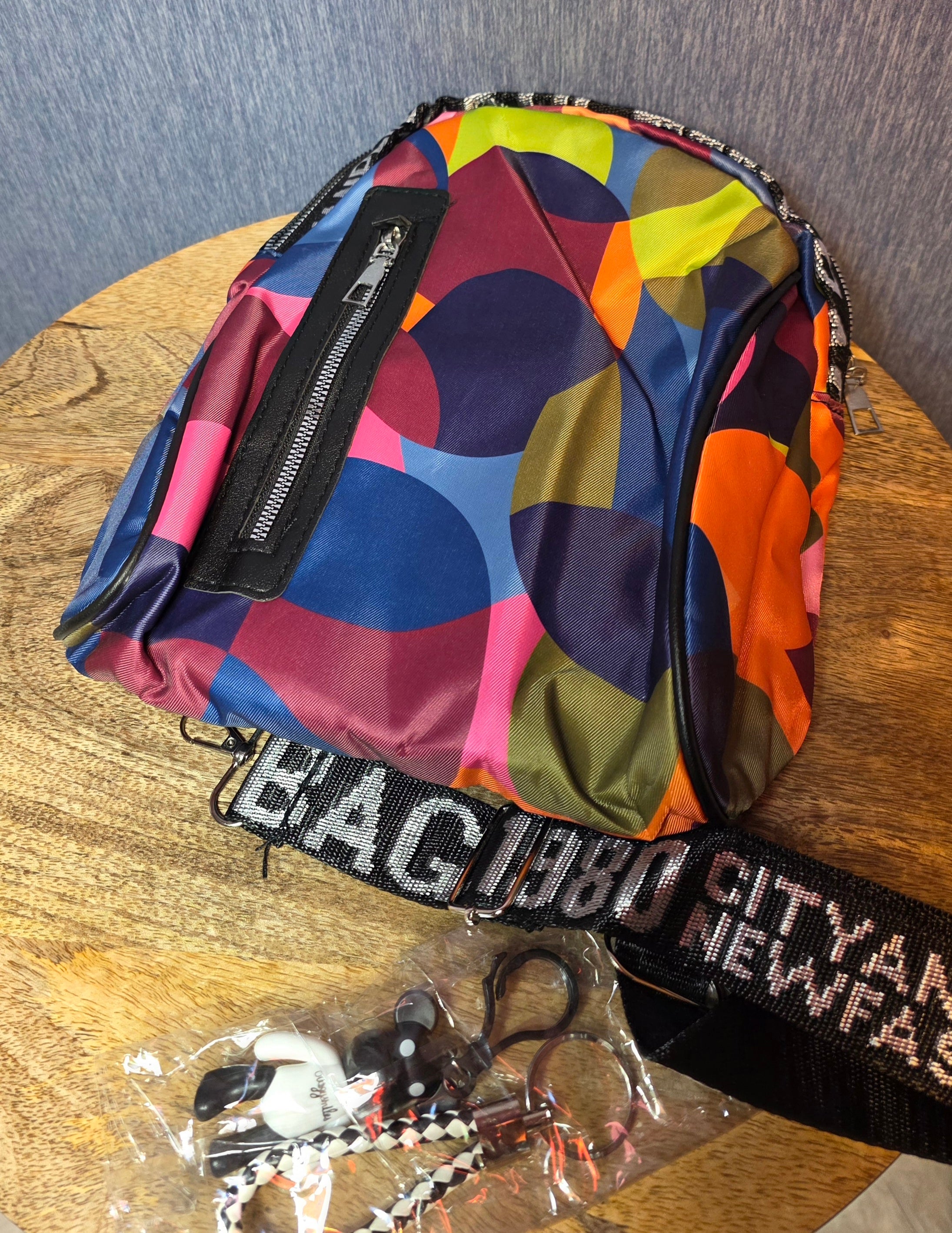 City and life sling small backpack with 2 charms