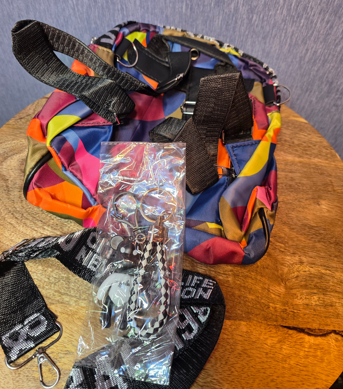 City and life sling small backpack with 2 charms