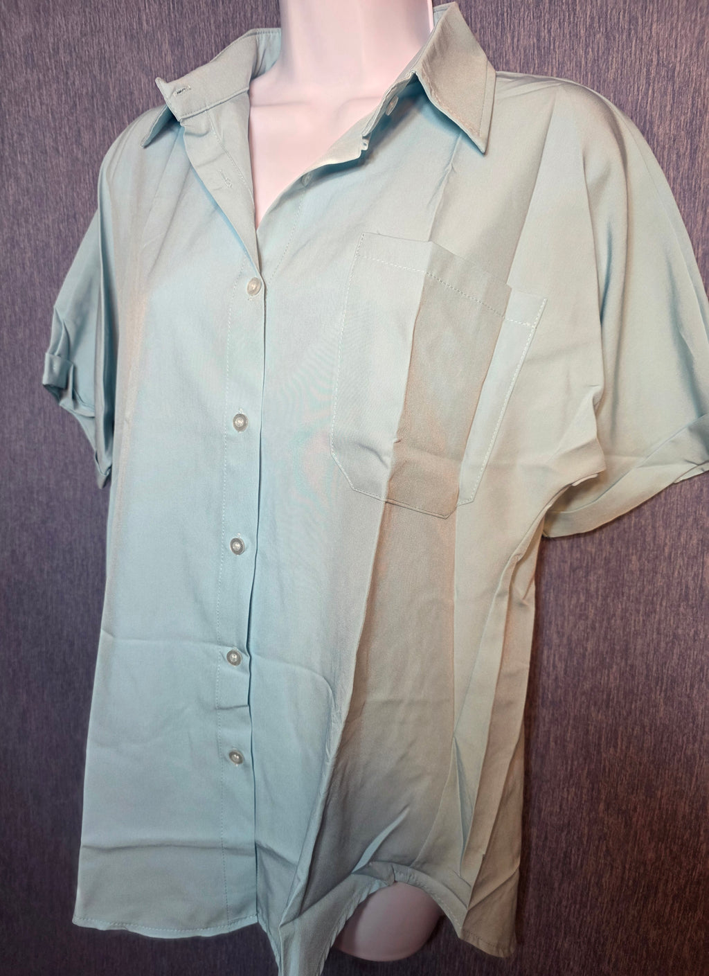 Button up top size meduim baby blue in color