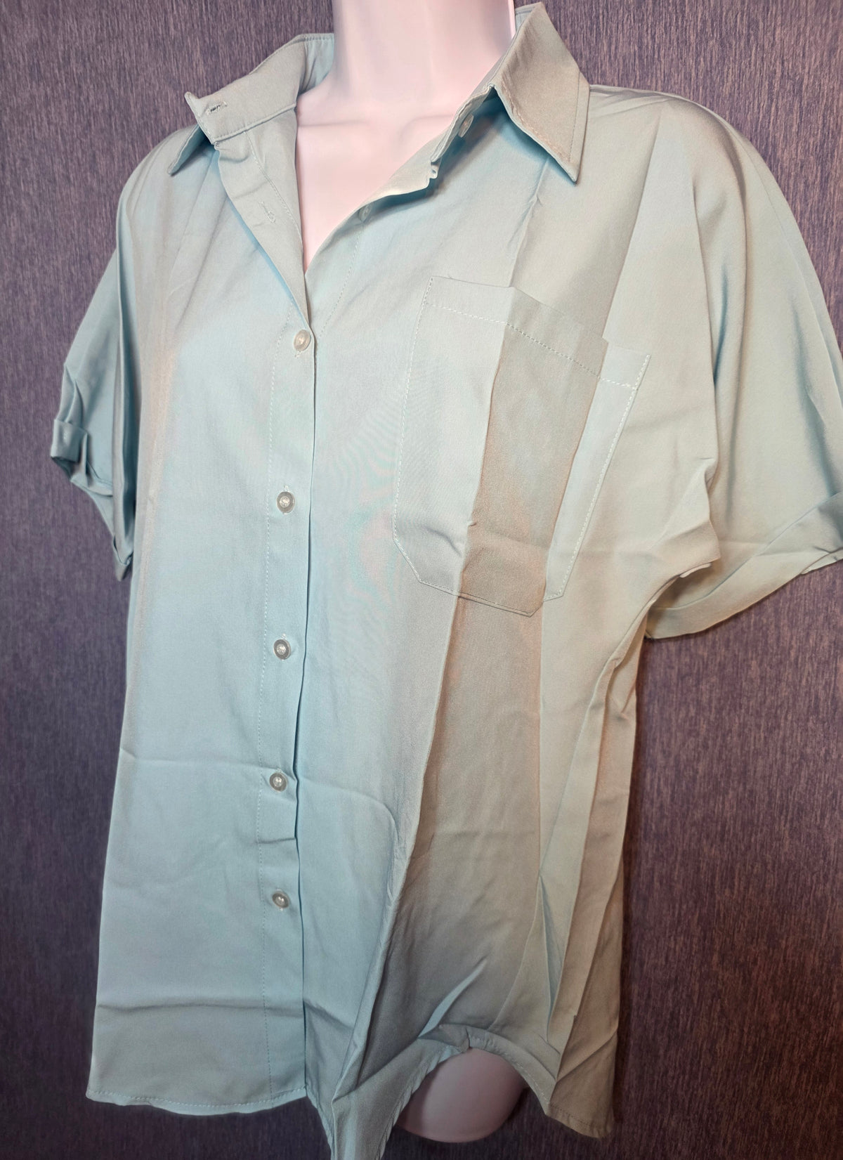Button up top size meduim baby blue in color
