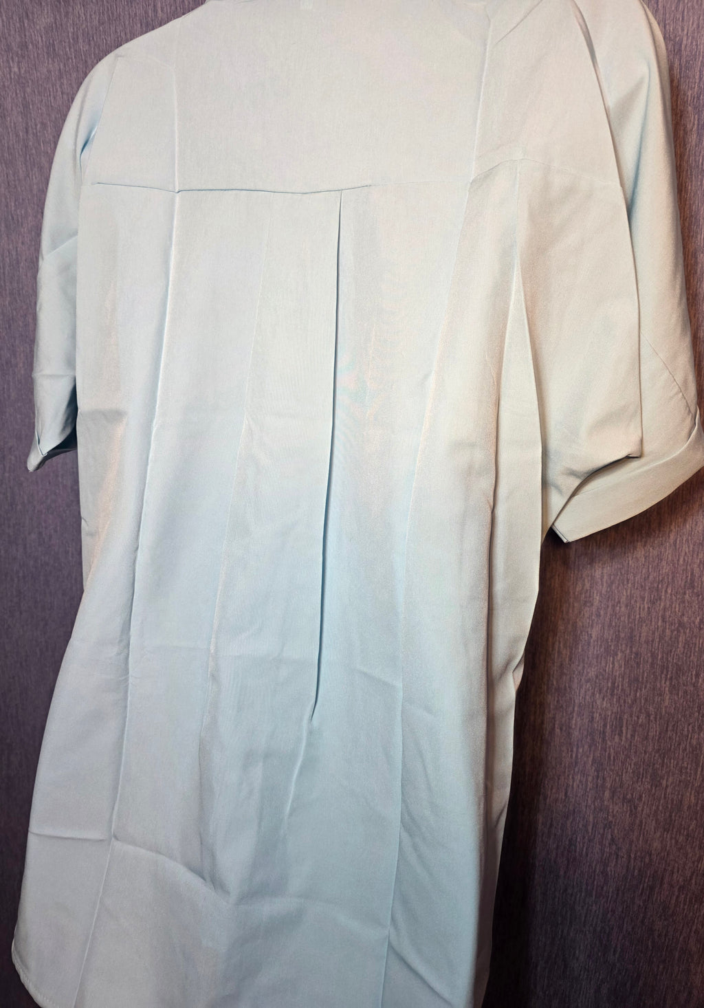 Button up top size meduim baby blue in color