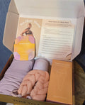 Tum to Mom set with a large pillow for relaxing comes with body scrubber / meduim house shoes meduim robe / scented candle face roller
