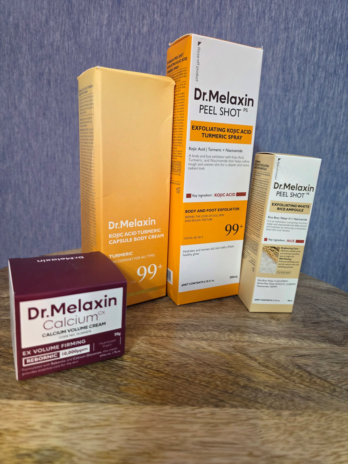 Dr.MELAXIN bundle of 4 full size products calcium volume cream , peel shot, body and foot tumeric spray, body cream