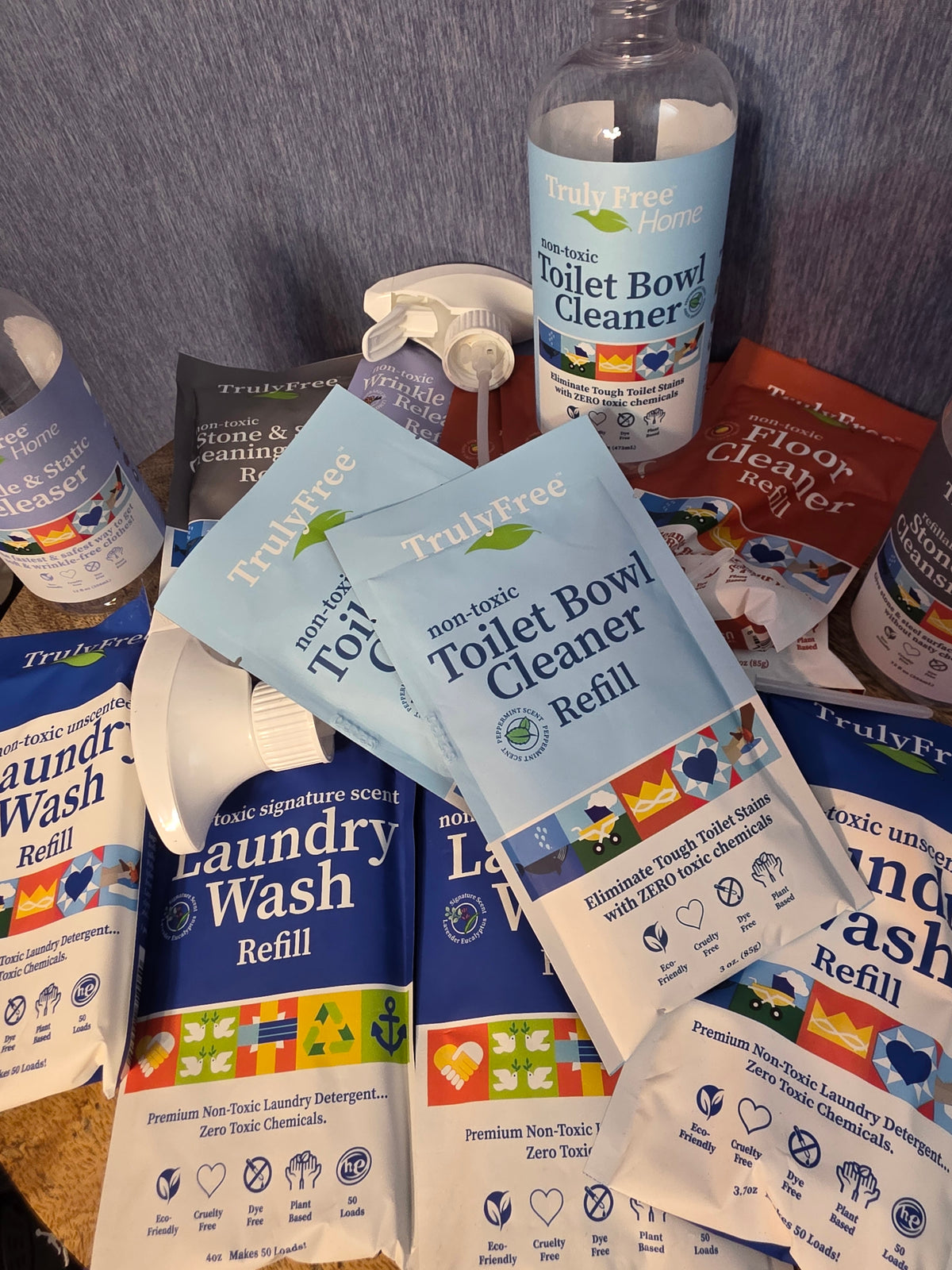 Truly Free cleaning bundle / 4 laundry wash refills / 1 stone and steal polish with bottle / 1 wrinkle release spray with bottle/ 4 floor cleaner refills / 2 toilet bowl cleaner refills with bottle